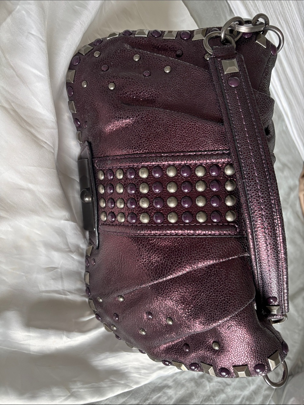 Coach metallic plum studded shoulder bag.